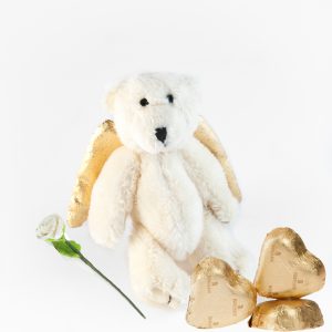 Isbjörnsnalle med guldvingar, vit ros och choklad