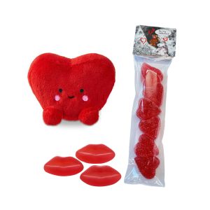 Glada röda hjärtat med goda sockrade Be my valentine-hjärtan och röda godismunnar